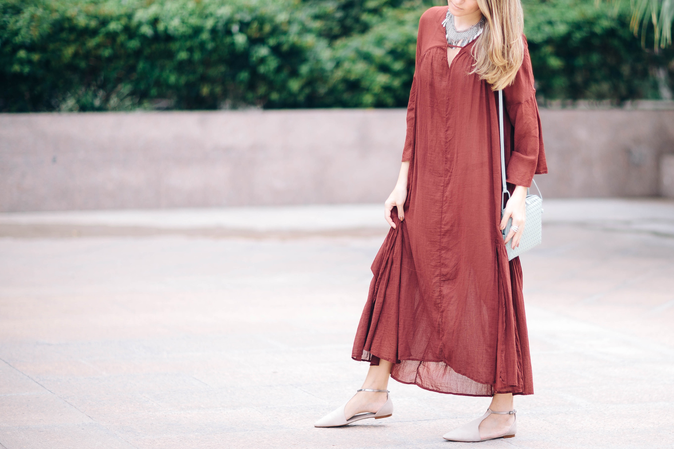Maristella Gonzalez of A Constellation blog wears a burgundy Maxi dress from H&M with nude Zara flats and YSL necklace
