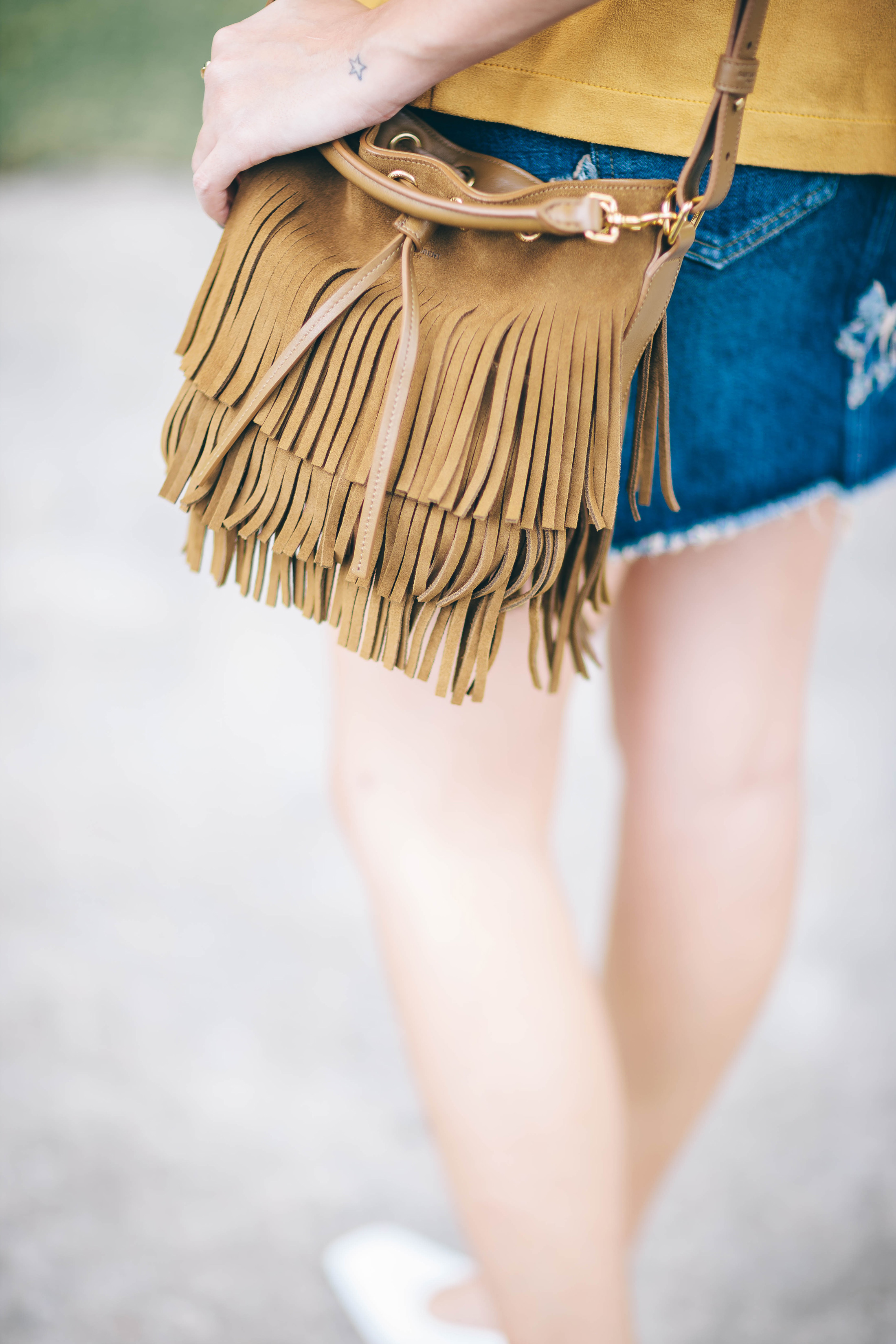 Saint Laurent Fringe Bucket Bag and Star Apliqué Denim Skirt