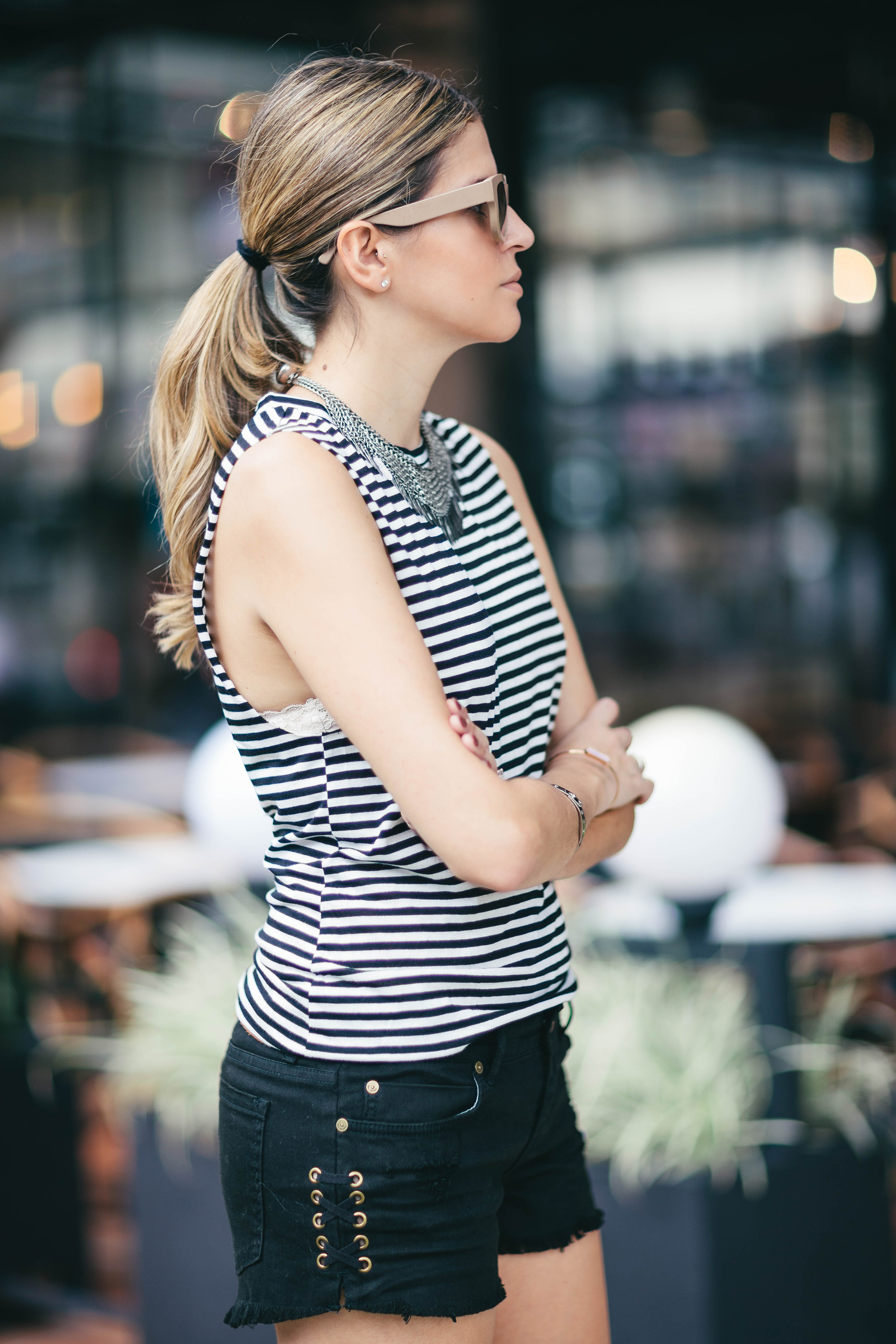 A Constellation blogger Maristella wears a stripe top, tragus piercing
