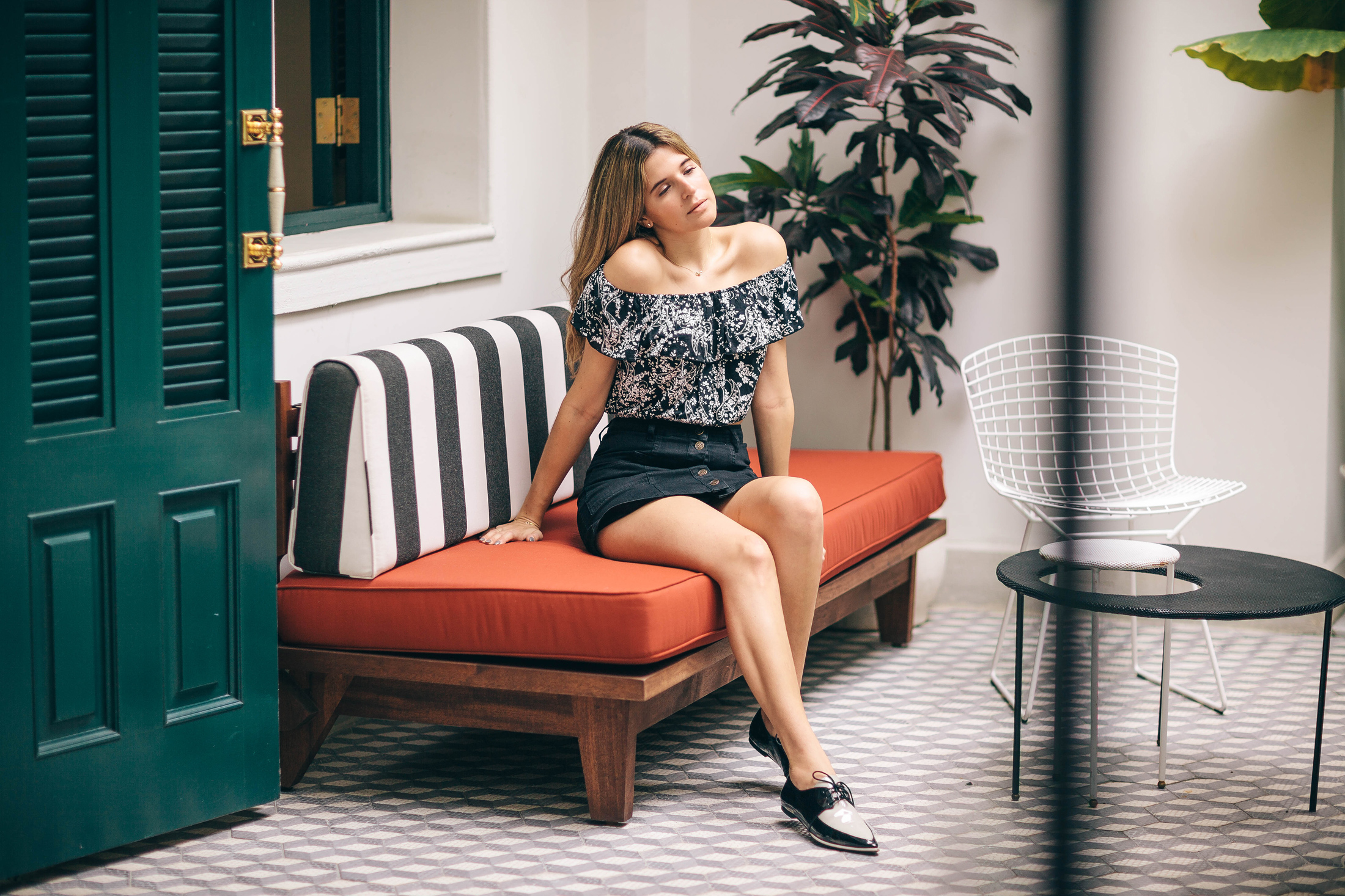 Maristella lounging at the American Trade Hotel wearing Stradivarius skirt and top with Zara pointy flats