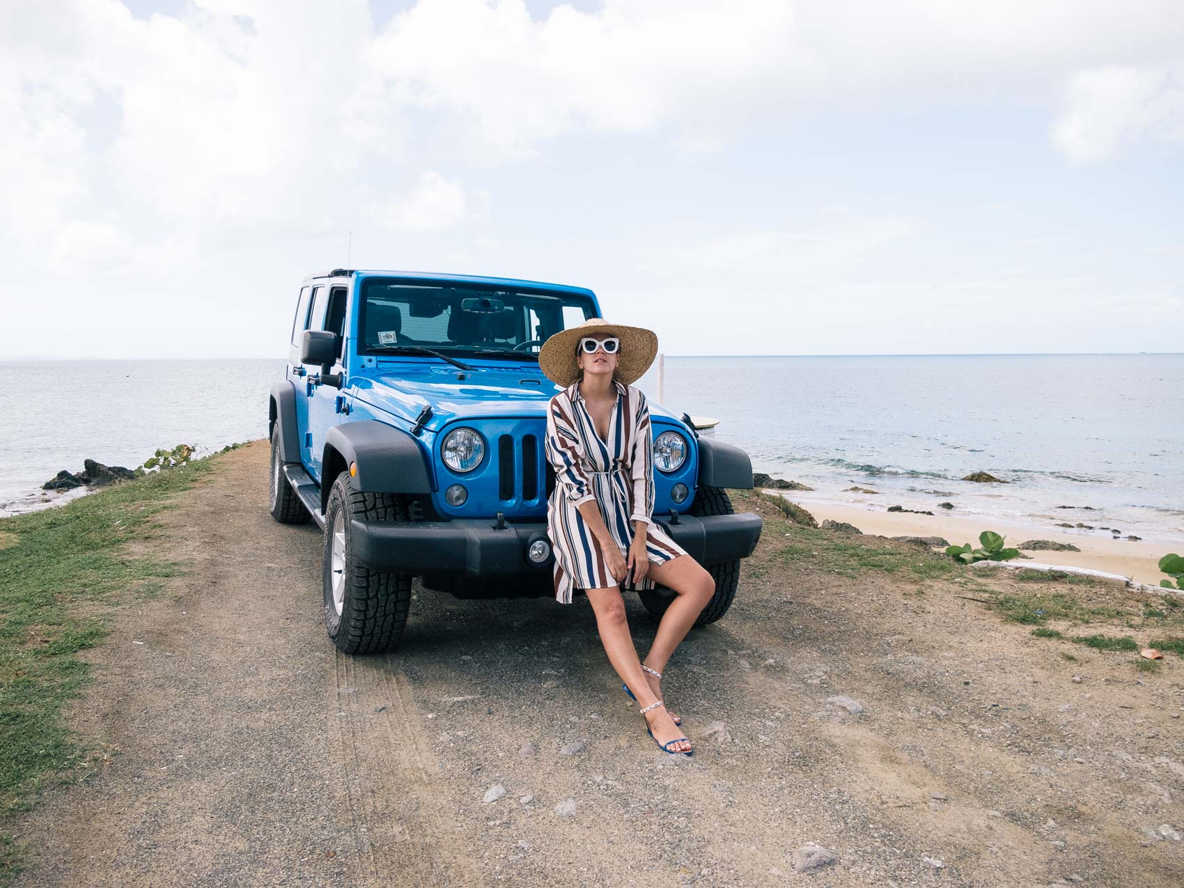 Maristella wears a Topshop stripe dress, Tory Burch sandals, straw wide brim hat and Celine sunglasses. Getting around Vieques Island in a Jeep