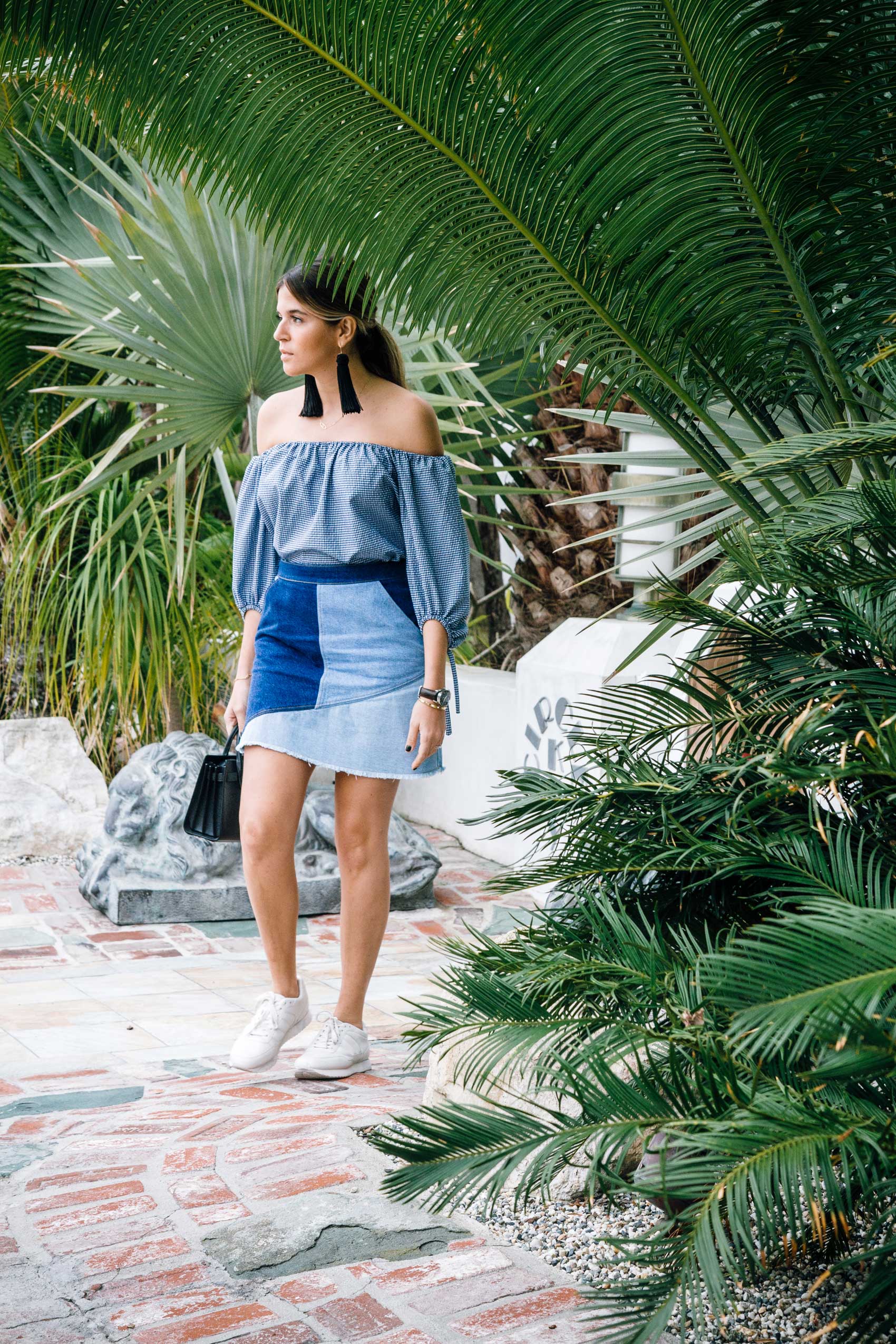 All blue denim and gingham look with white sneakers and statement earrings by Maristella Gonzalez