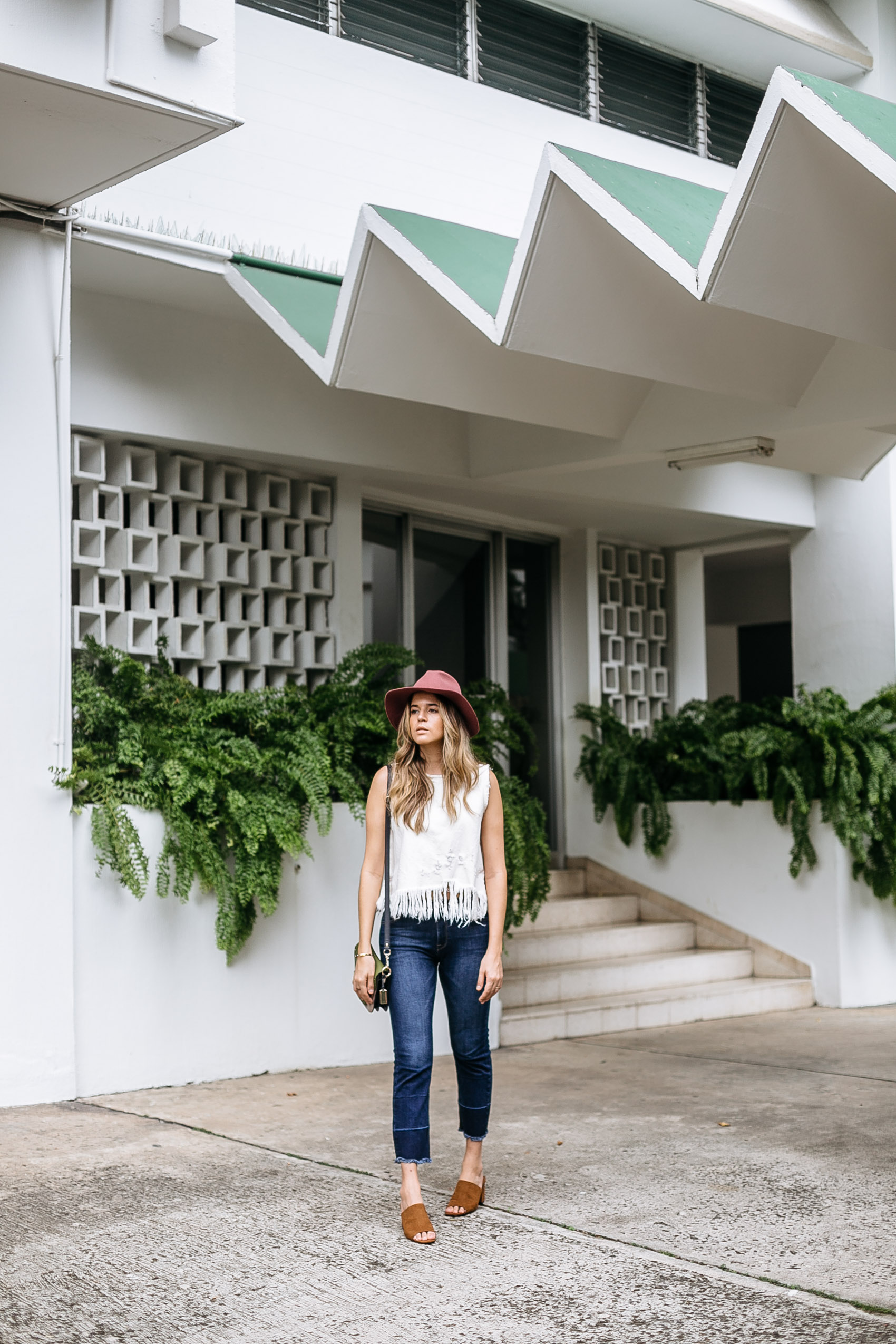 Blogger Maristella in front of a Panama tropical modernist apartment building from the 1960s or 70s