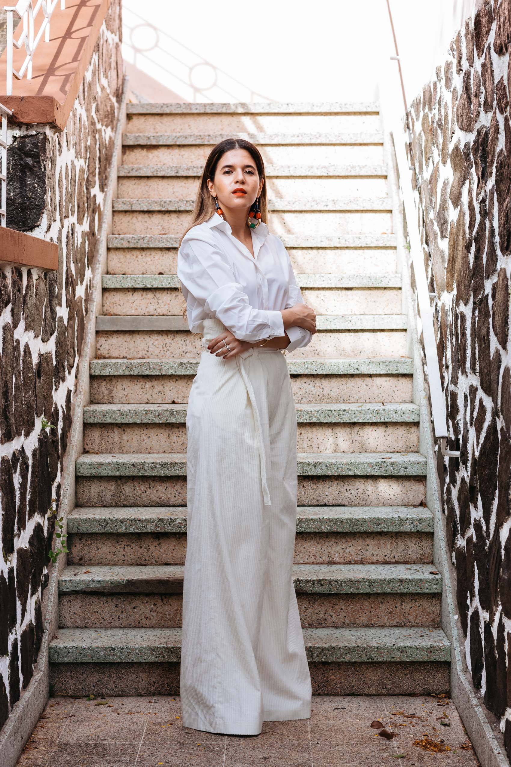 Maristella wears a white shirt and high waist corduroy pants from H&M Studio AW16 collection