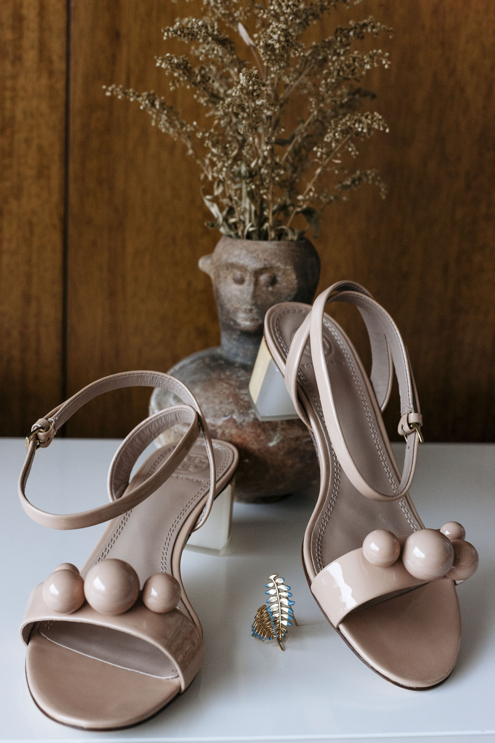 Tory Burch patent nude sandals with spheres and fern ear crawler earrings