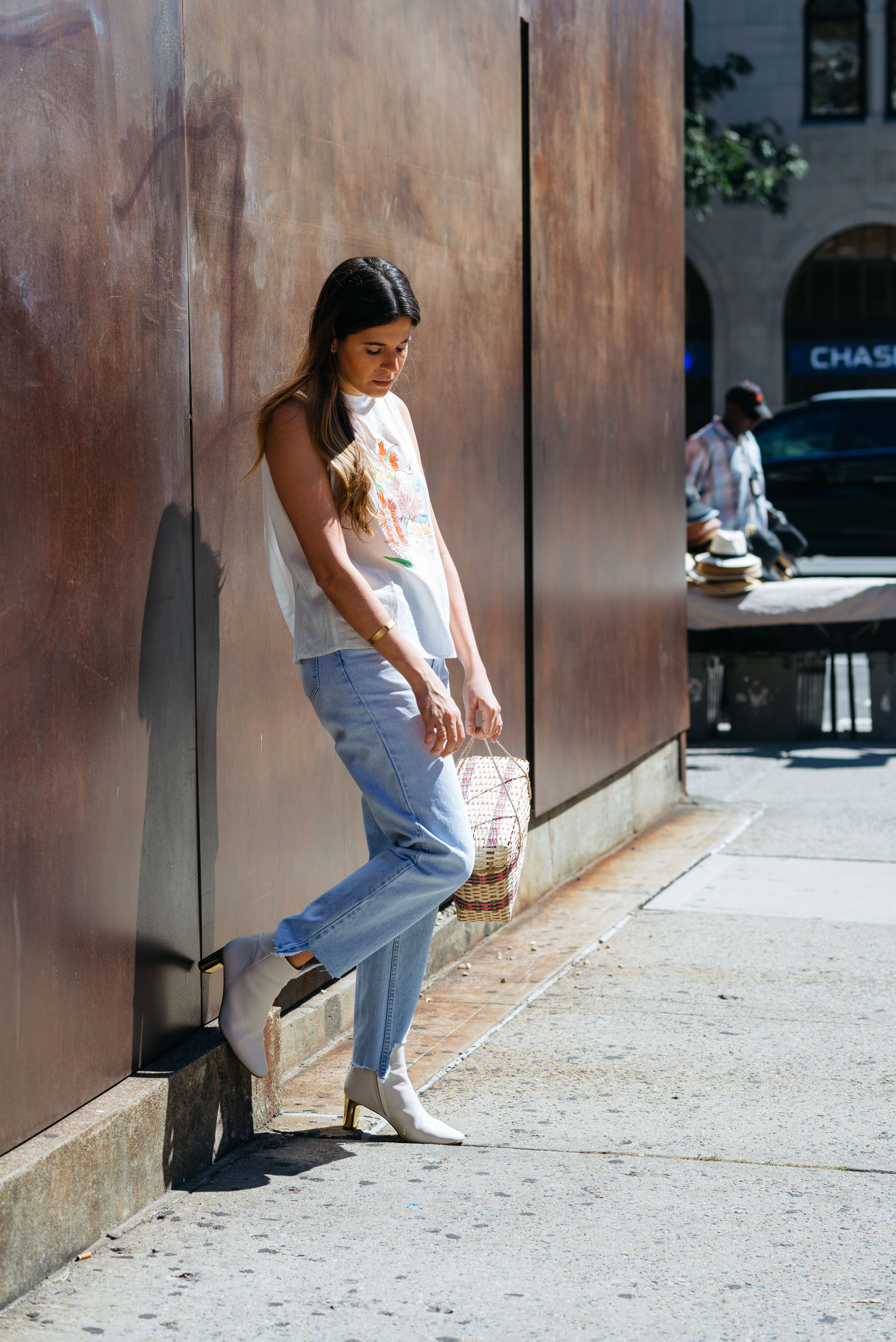 Blogger Maristella's casual jeans and loose top outfit at New York Fashion Week