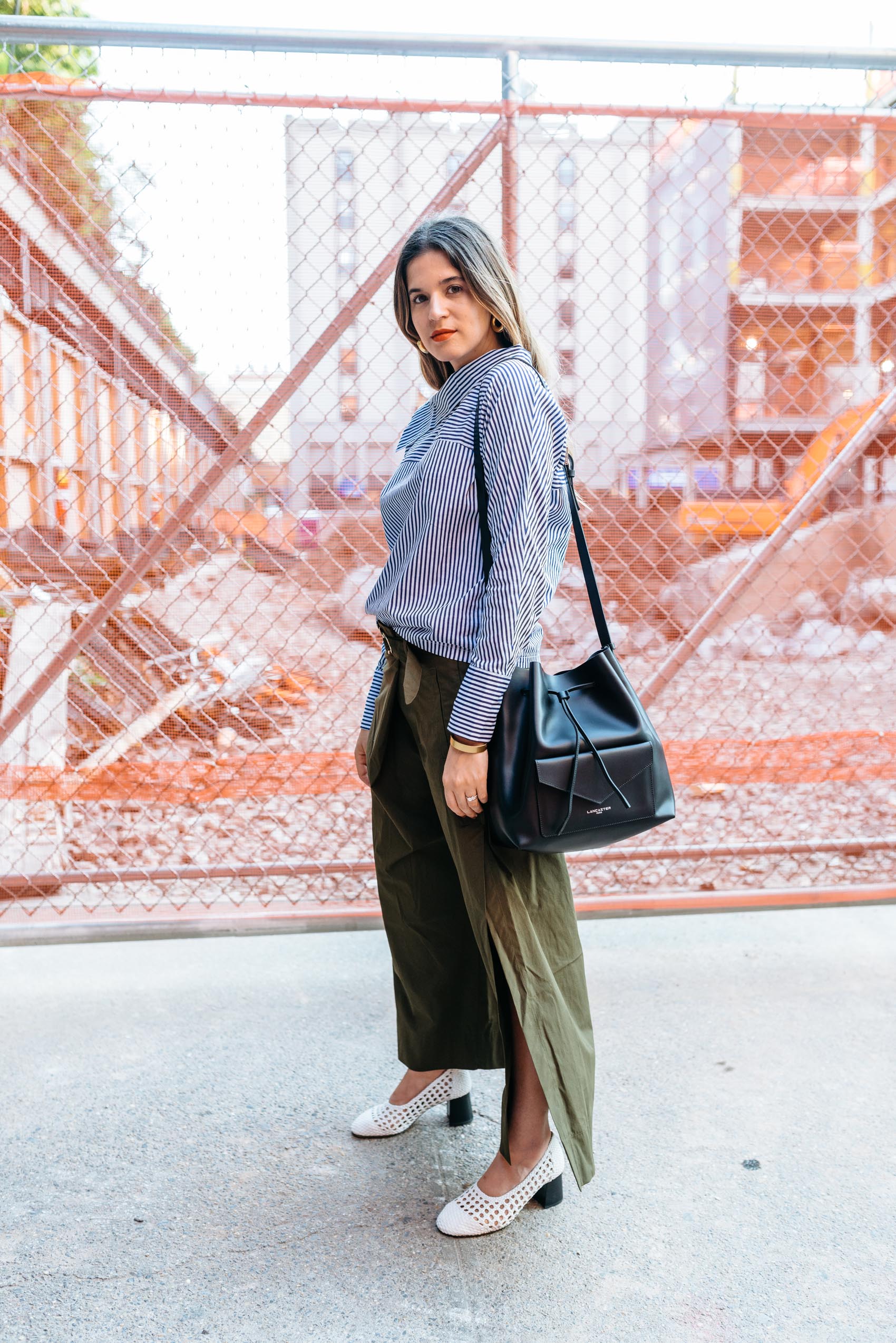 Maristella wearing a casual chic outfit at NYFW with a Felix shirt, Zara pants, Sandro Paris shoes and Lancaster bag
