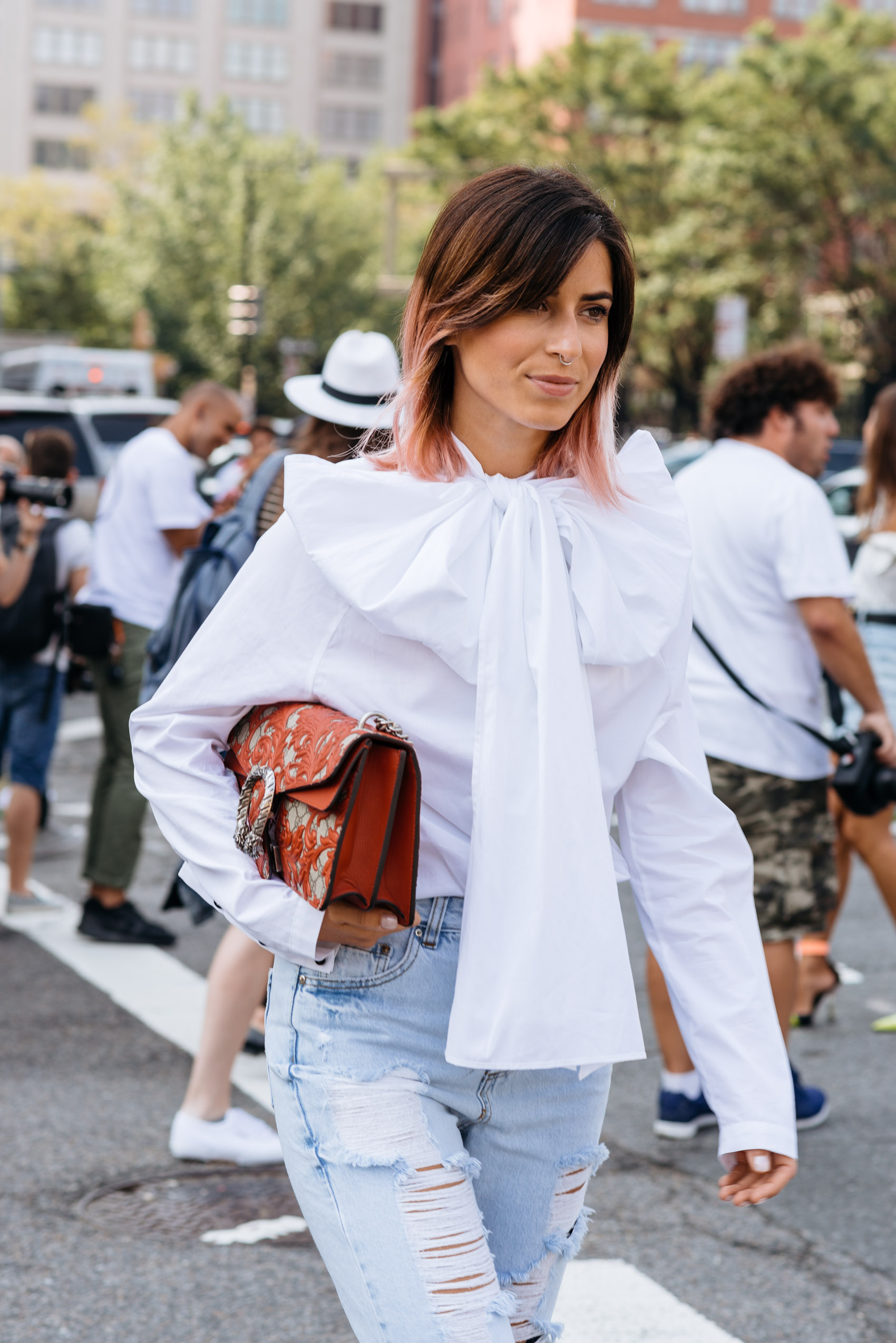 Ombré pink hair, statement bow, vintage denim and Gucci dionysus bag street style at NYFW