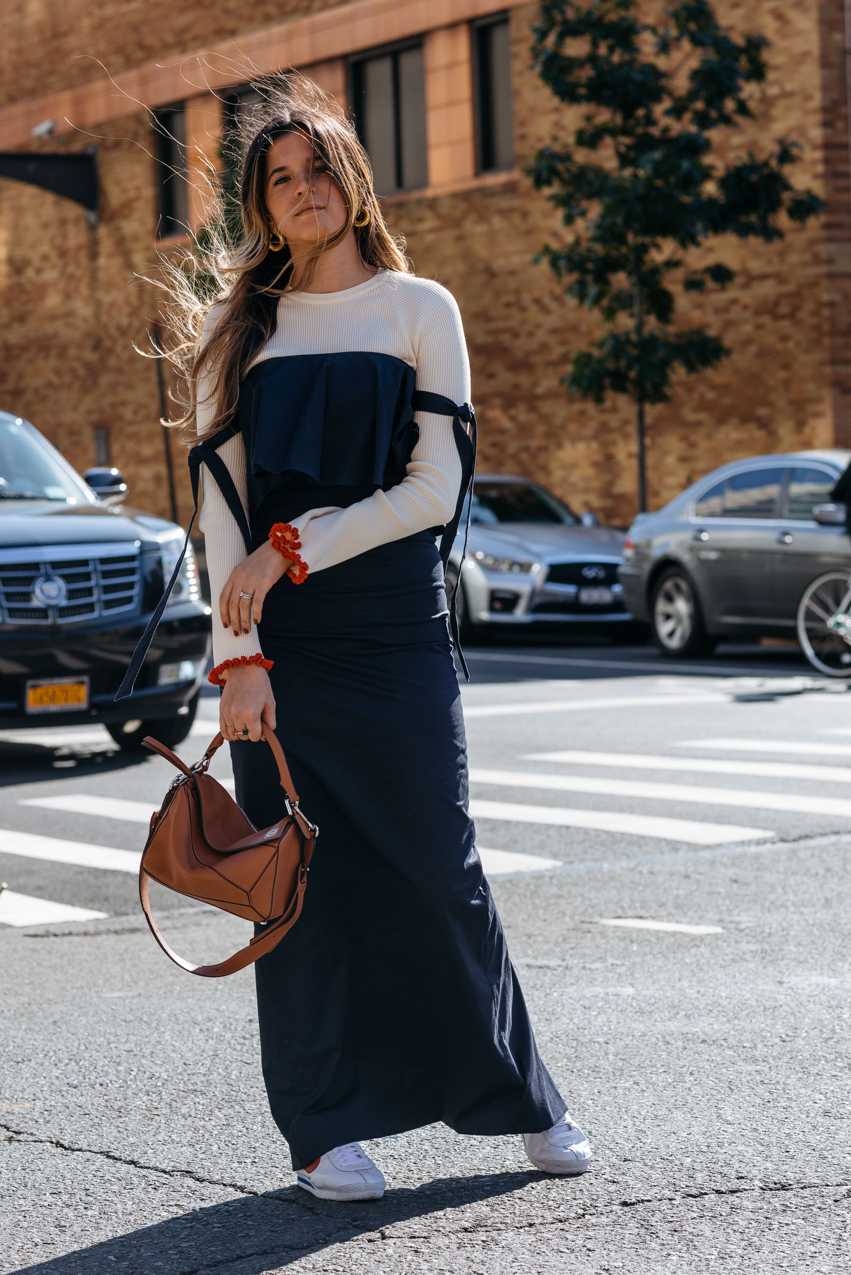 Maristella wearing a chic minimalist outfit with feminine details for Fall
