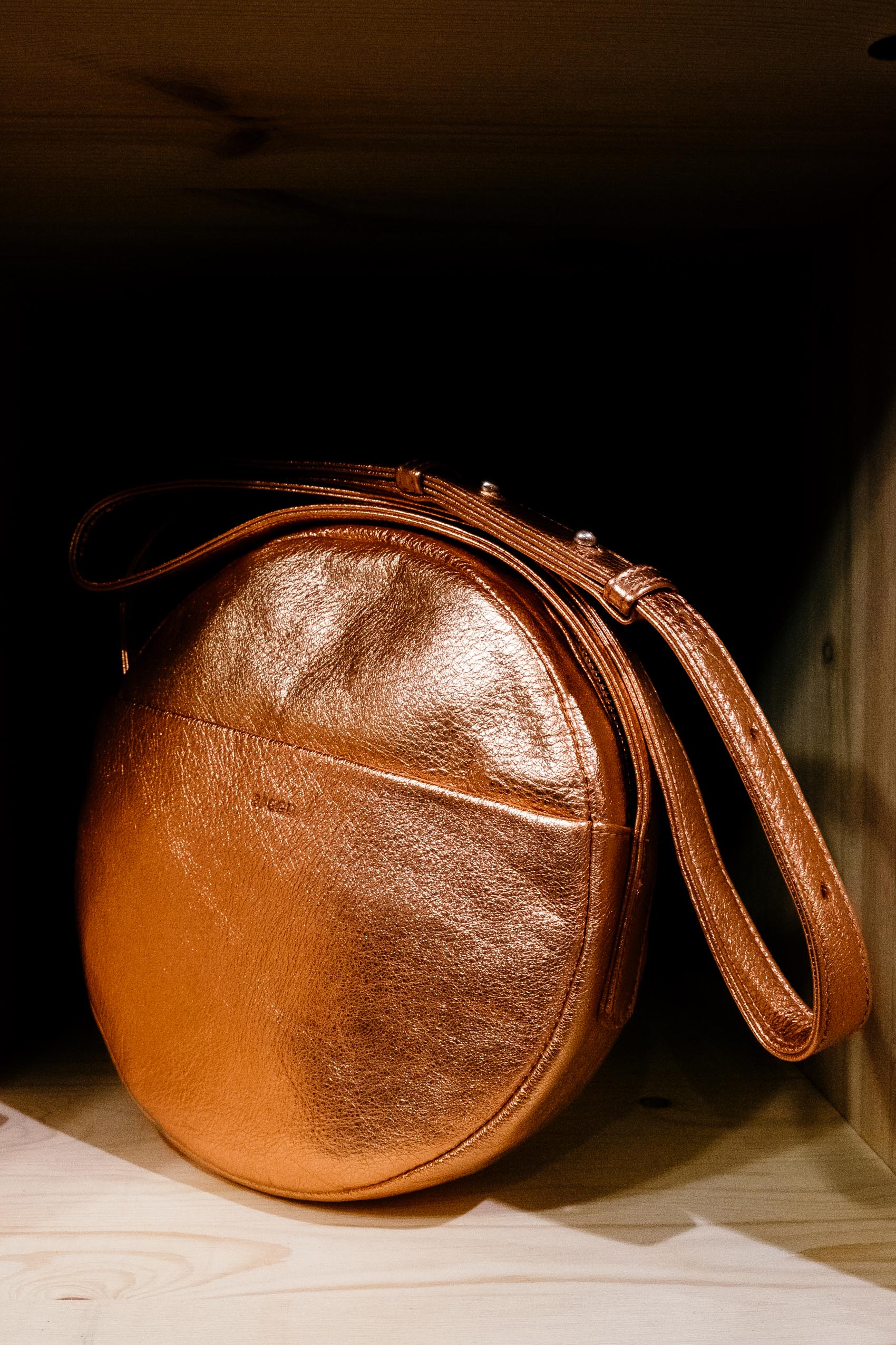 Rose Gold Copper leather circle bag from Baggu