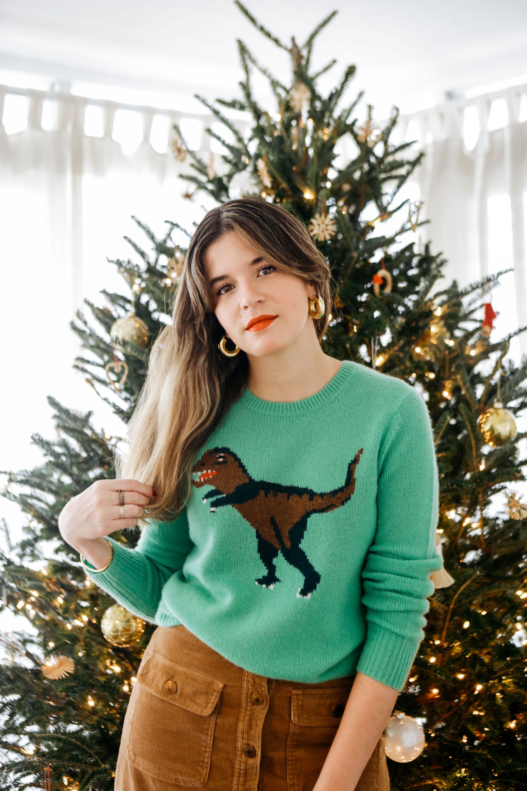 Christmas sweater by Coach with Rexy the dinosaur 