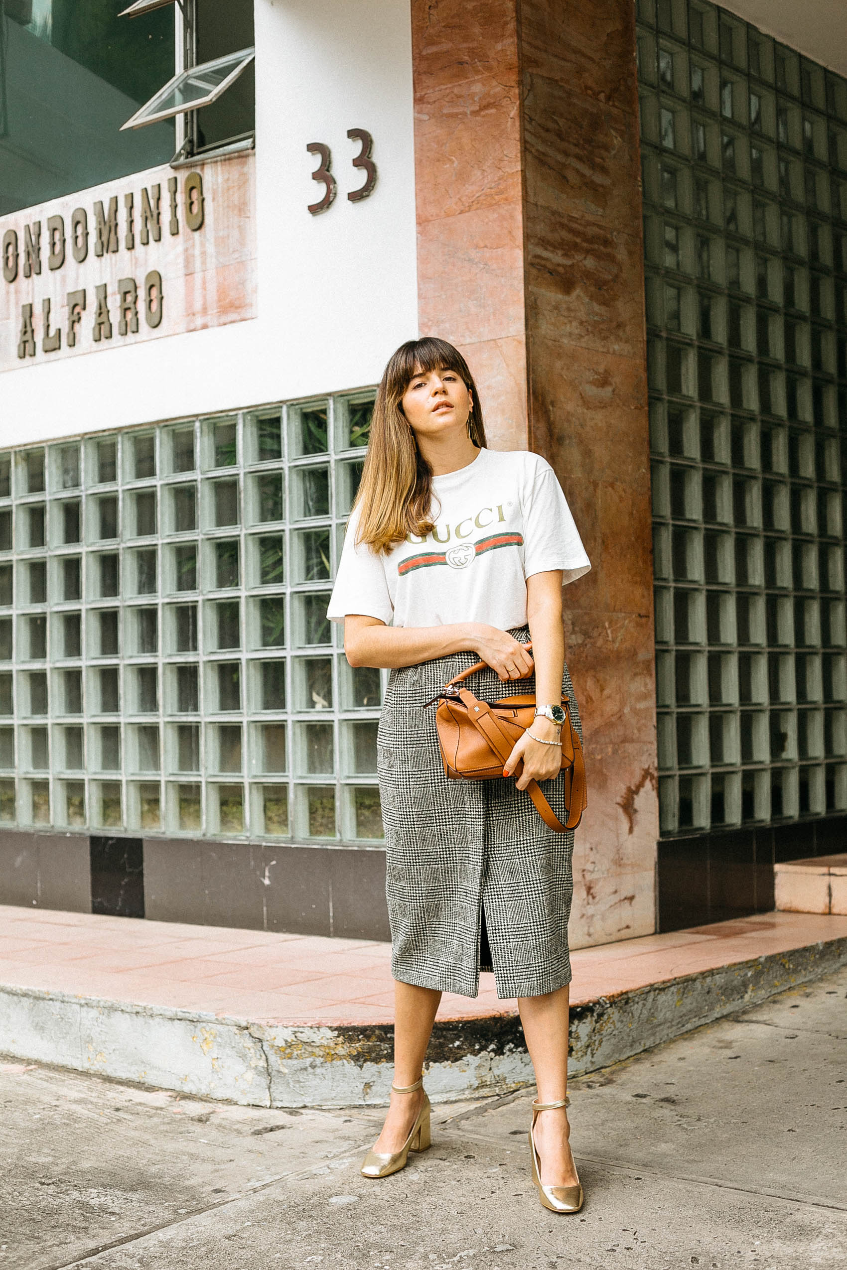Maristella wears a Gucci cotton logo t-shirt with a vintage wool pencil skirt from MaxMara