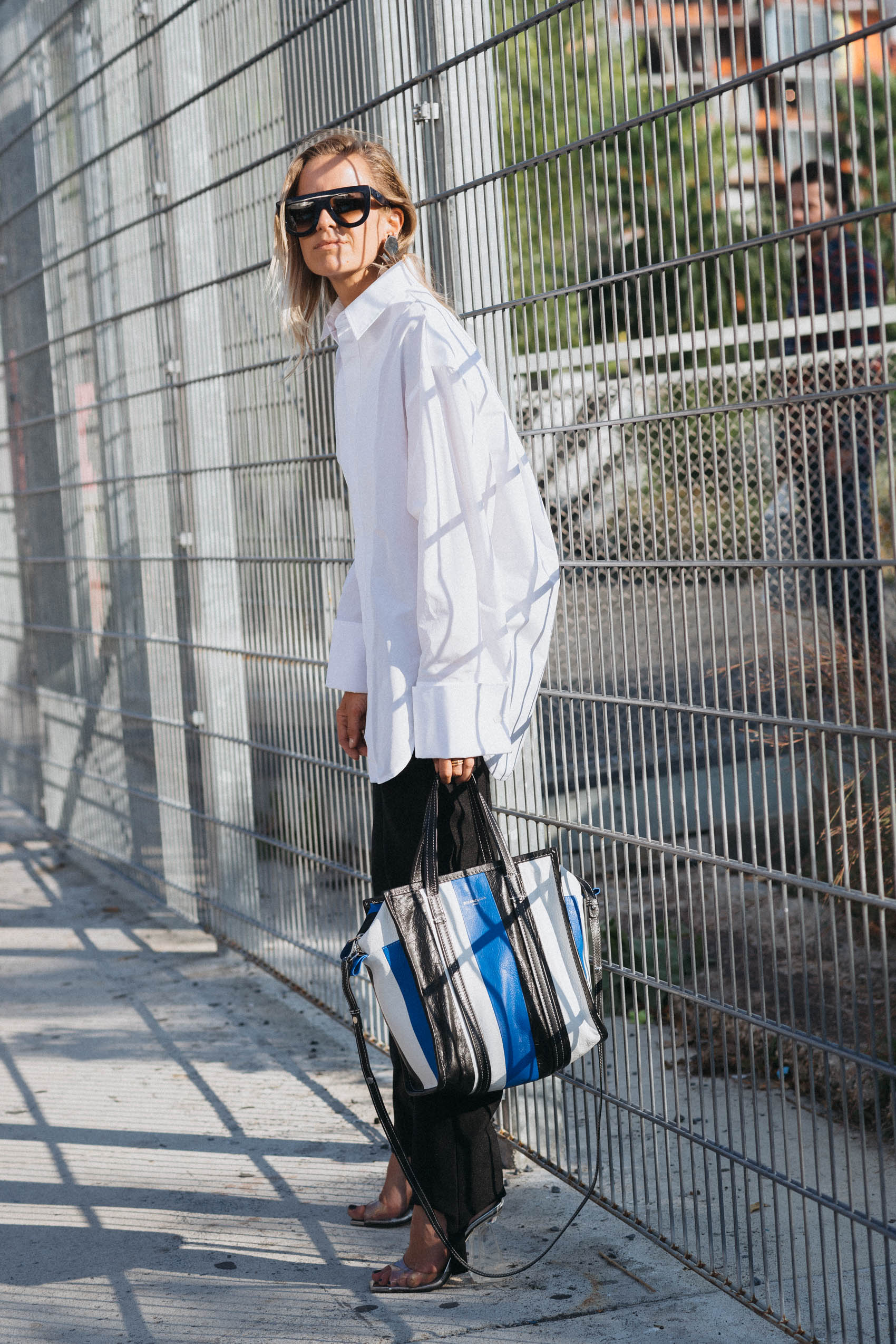 New York Fashion Week blogger style with Celine sunglasses, stirrups pants and Balenciaga shopping bag