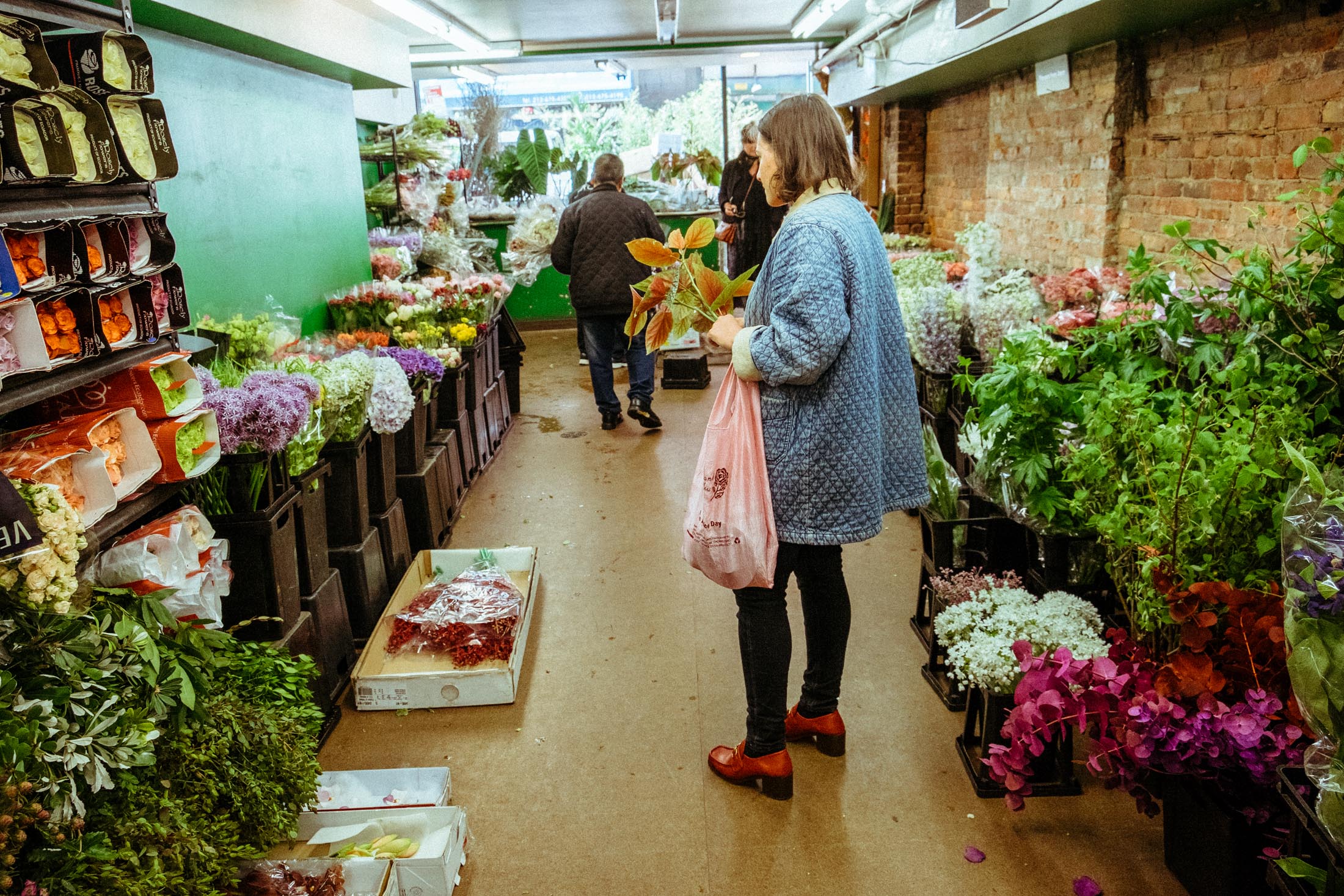Florist Brittany Asch shops for flowers on 28th street in New York