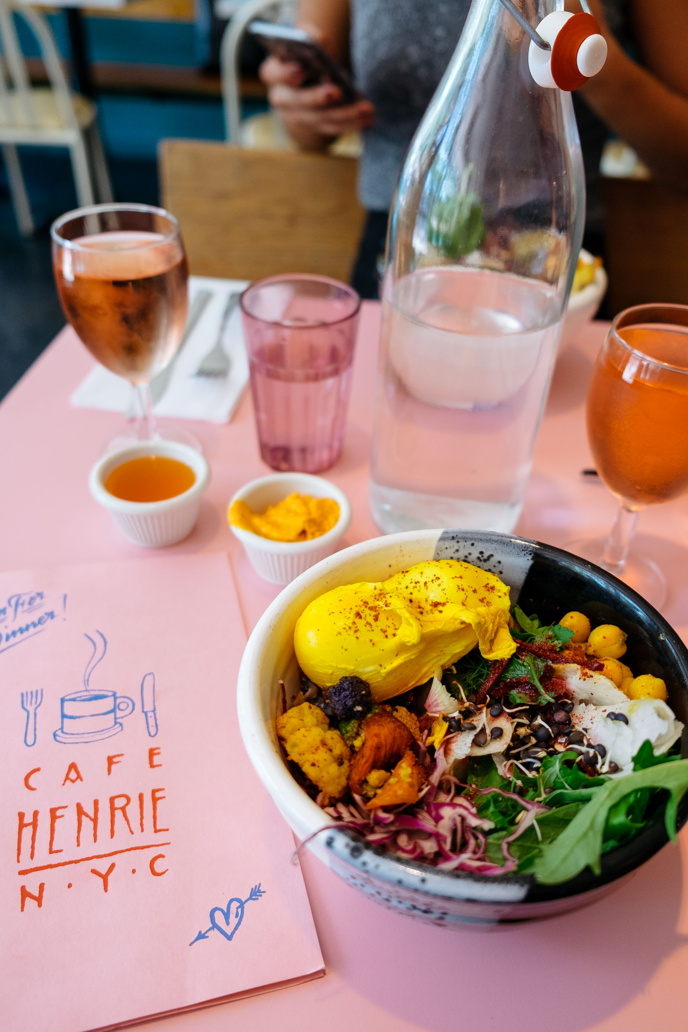 Millennial Pink table, menu, and glasses at Café Henrie in New York