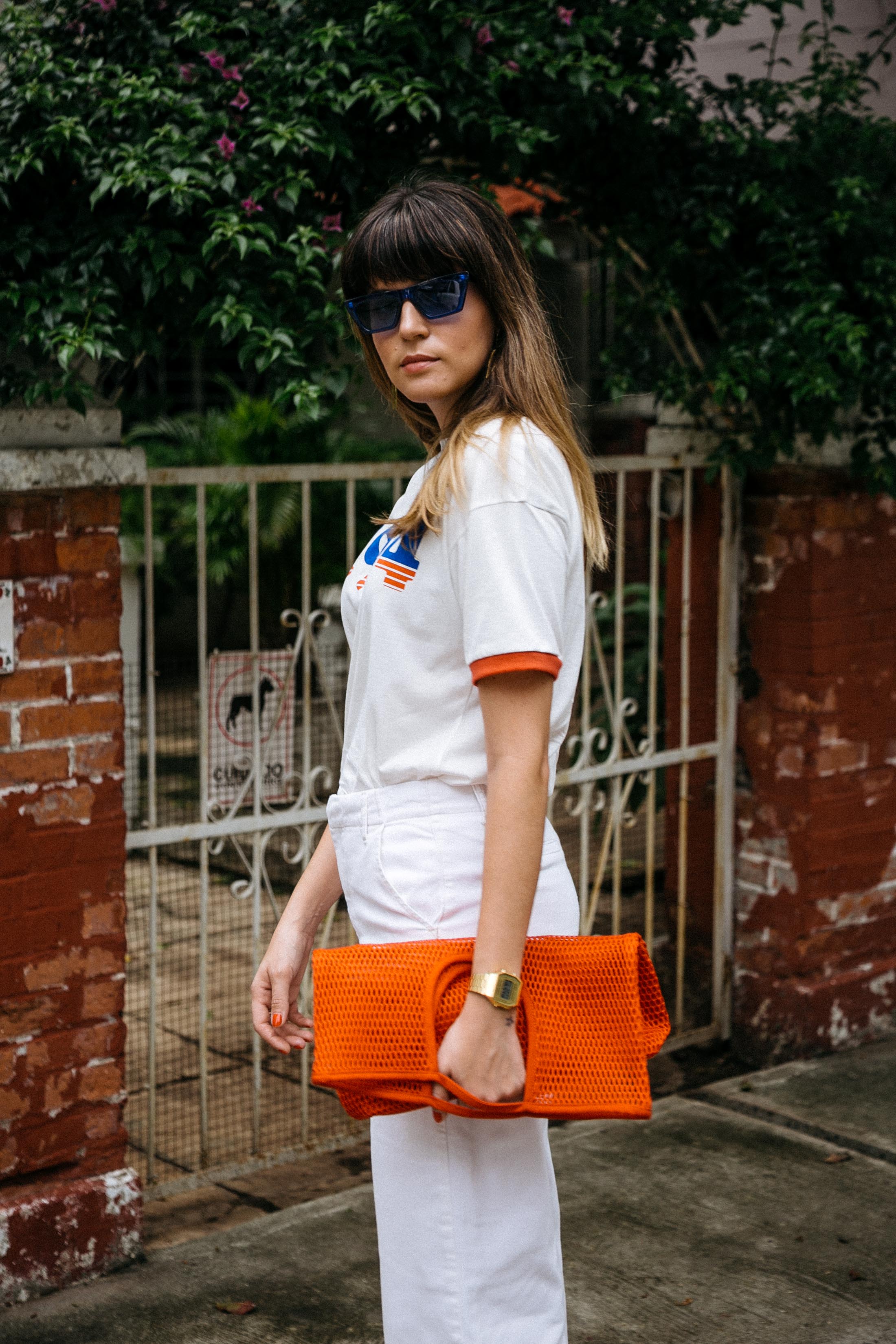 Maristella wearing a ringer tee and net bag from COS