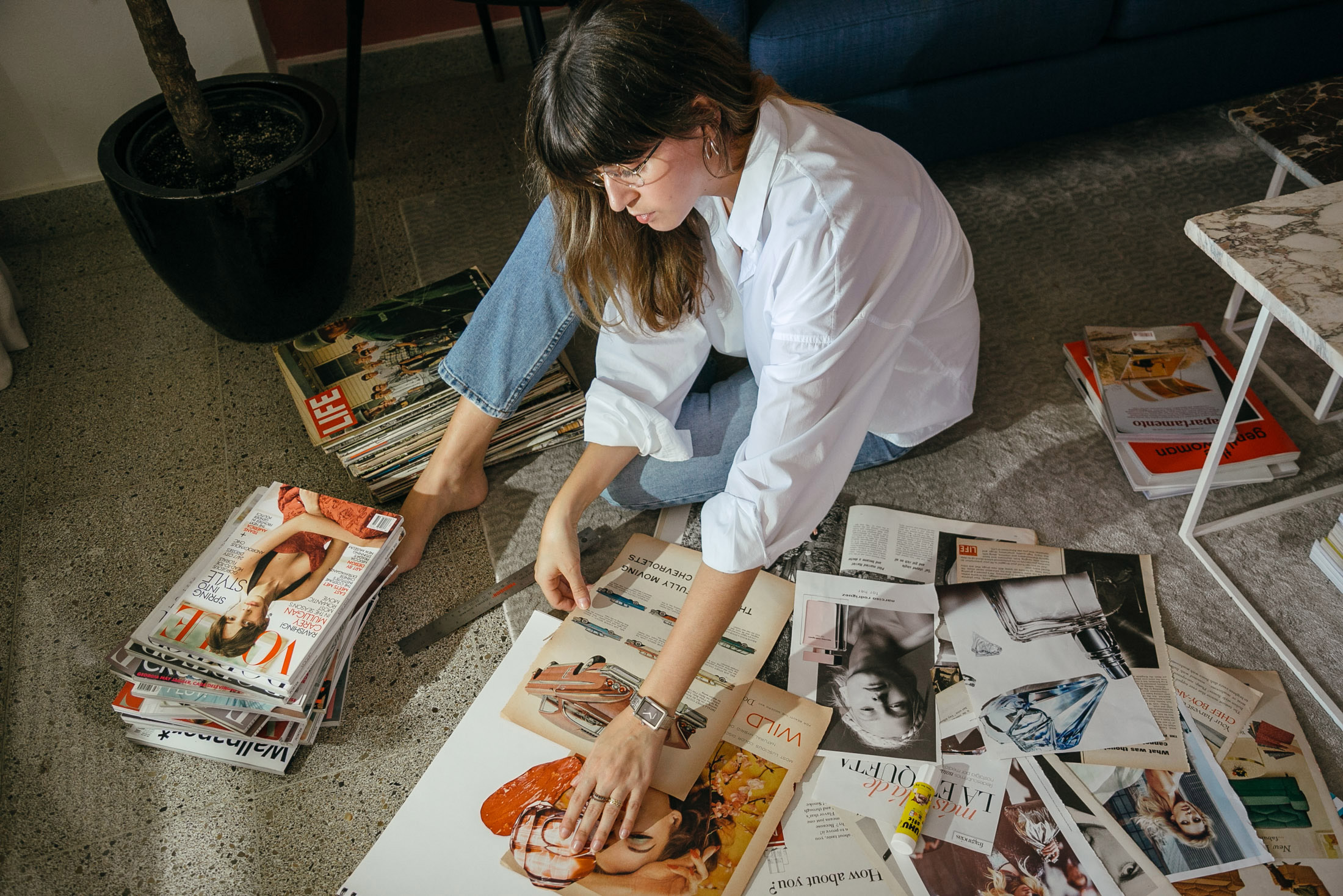 Maristella looks through vintage Life Magazines and fashion magazines for her collages
