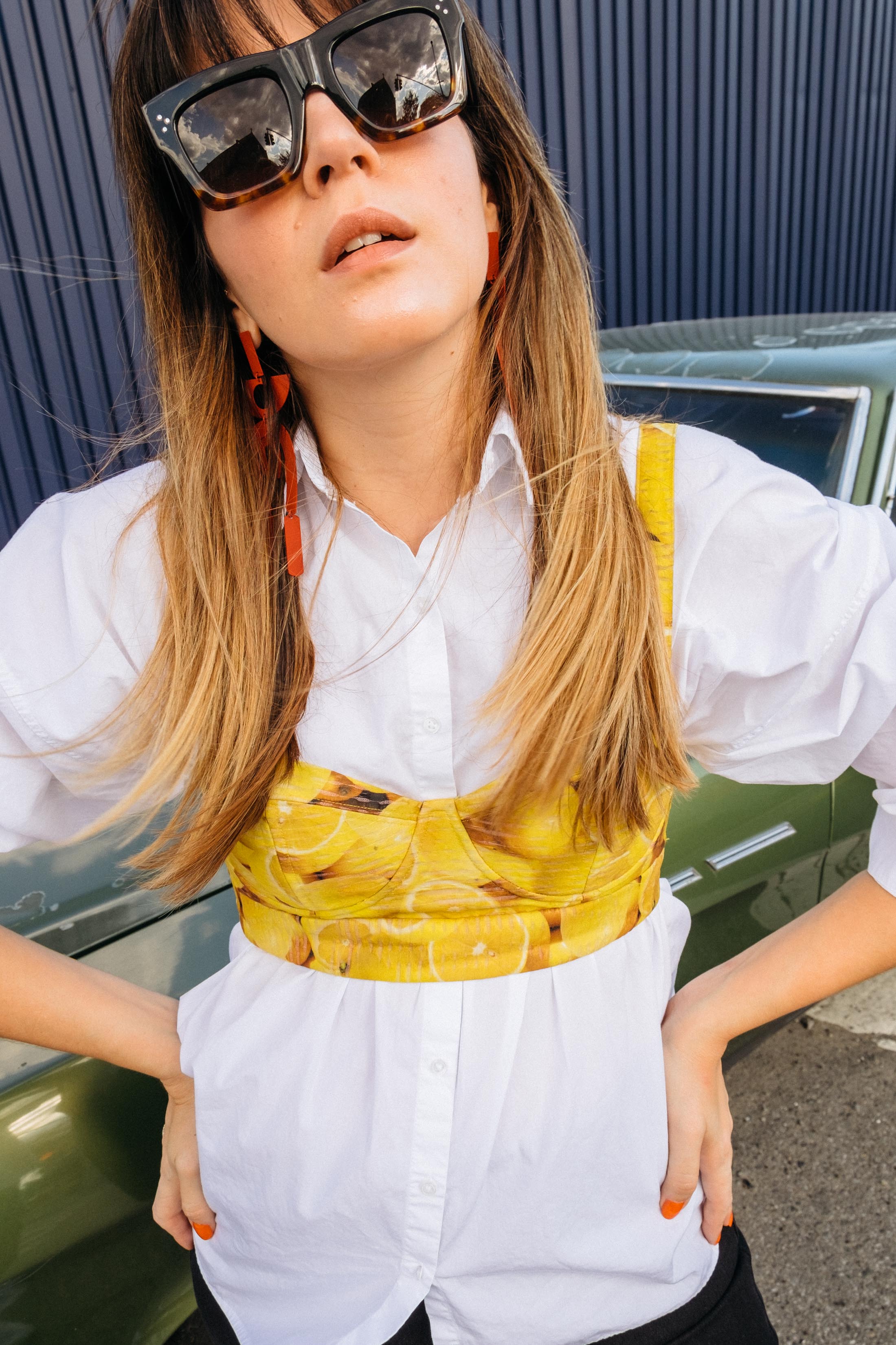 Alice & Olivia lemon print bustier top with a white button down shirt by Maristella