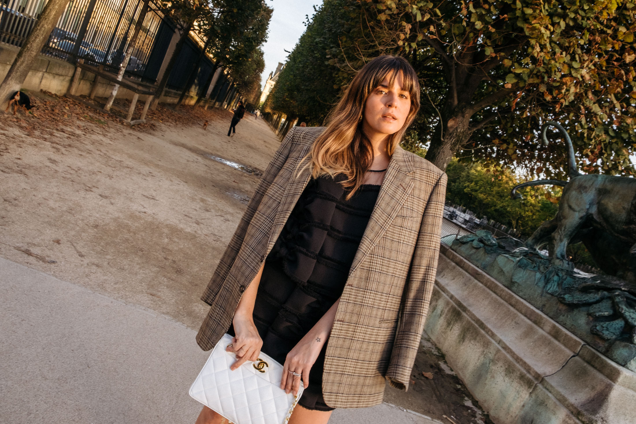 Maristella wearing an oversize blazer with a bow embellished skirt and top set in Paris