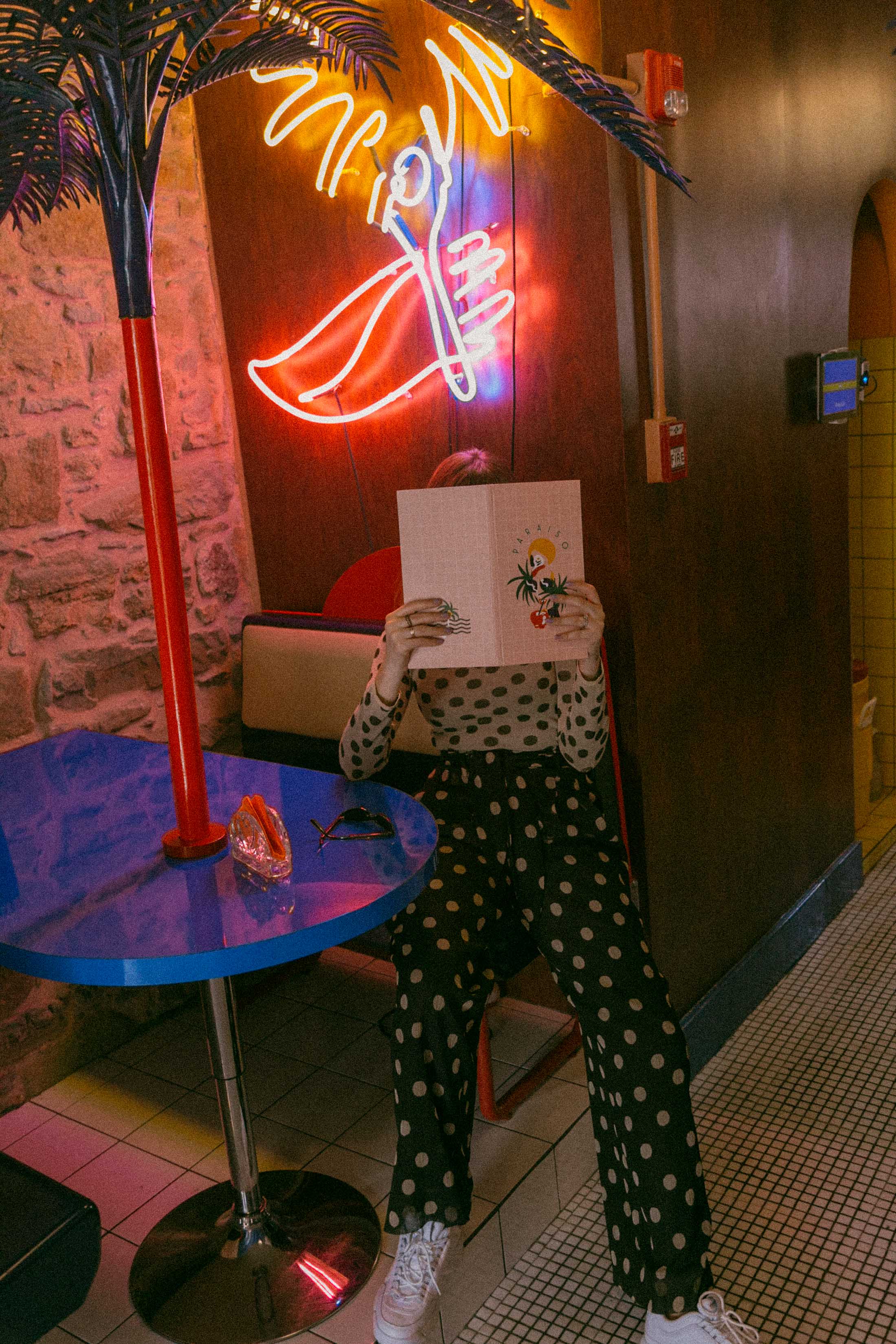 Maristella wears a dotted set from Nanushka and Fila white chunky sneakers from Urban Outfitters